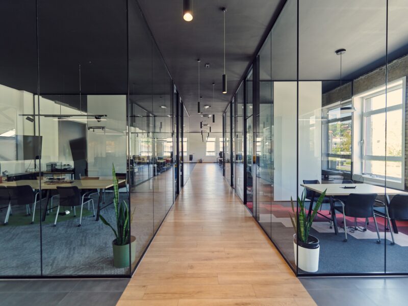 In,A,Setting,Of,Modern,,Glass walled,Business,Startup,Offices,,The