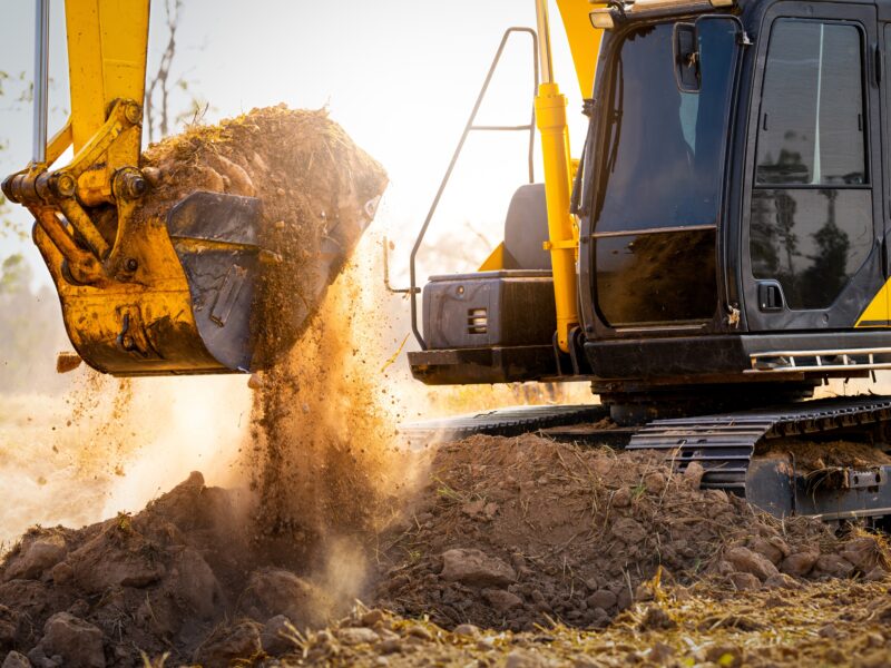 Close up,Of,Excavator,At,Construction,Site.,Backhoe,Digging,Soil,For